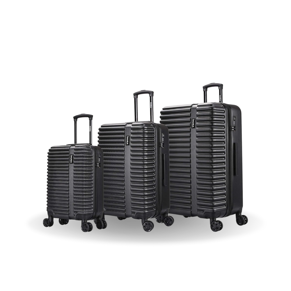 Set of black suitcases of different sizes on a white background