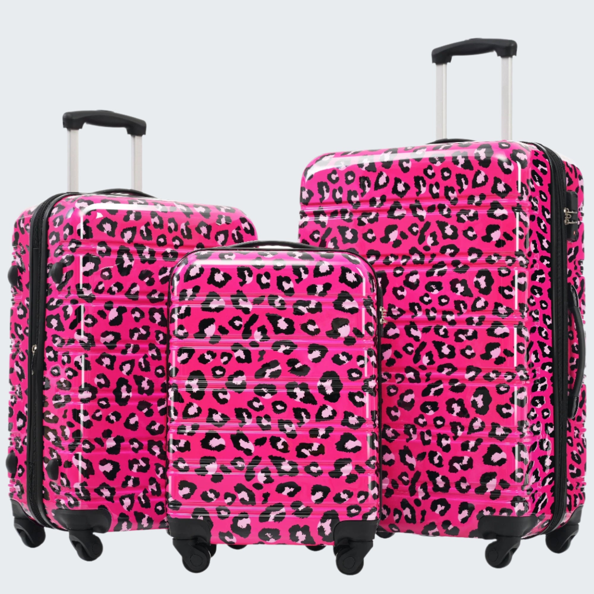 A set of three pink leopard print hardshell suitcases with spinner wheels and telescopic handles.