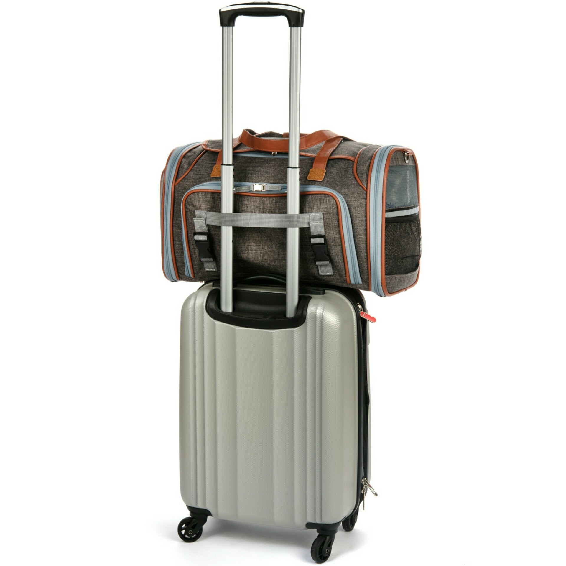 Silver suitcase with a gray and brown duffel bag on top against a white background