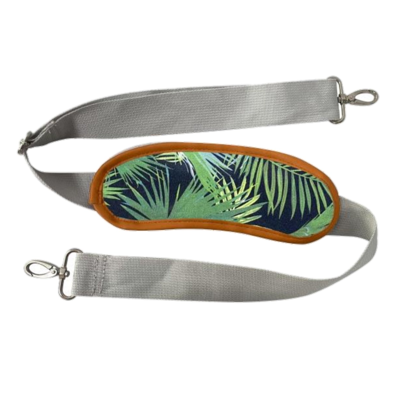 Gray strap with a green leaf patterned patch on a white background