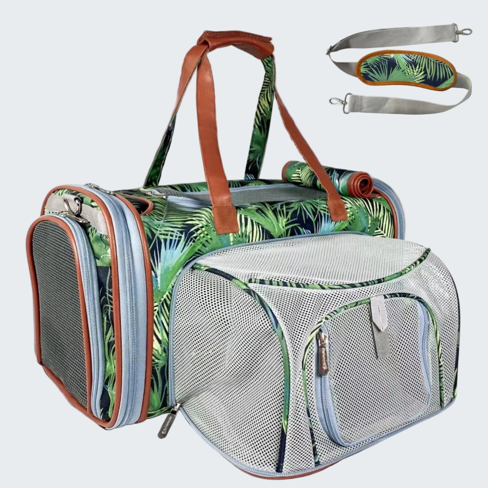 Pet carrier with tropical leaf pattern and detachable straps on a white background
