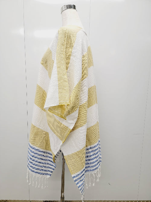Mannequin wearing a yellow and white striped towel with blue accents on a white background