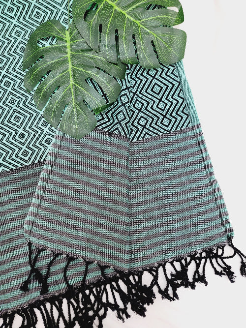 Striped towel with fringes on a white background