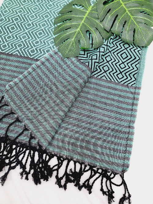 Striped towel with black tassels on a white background