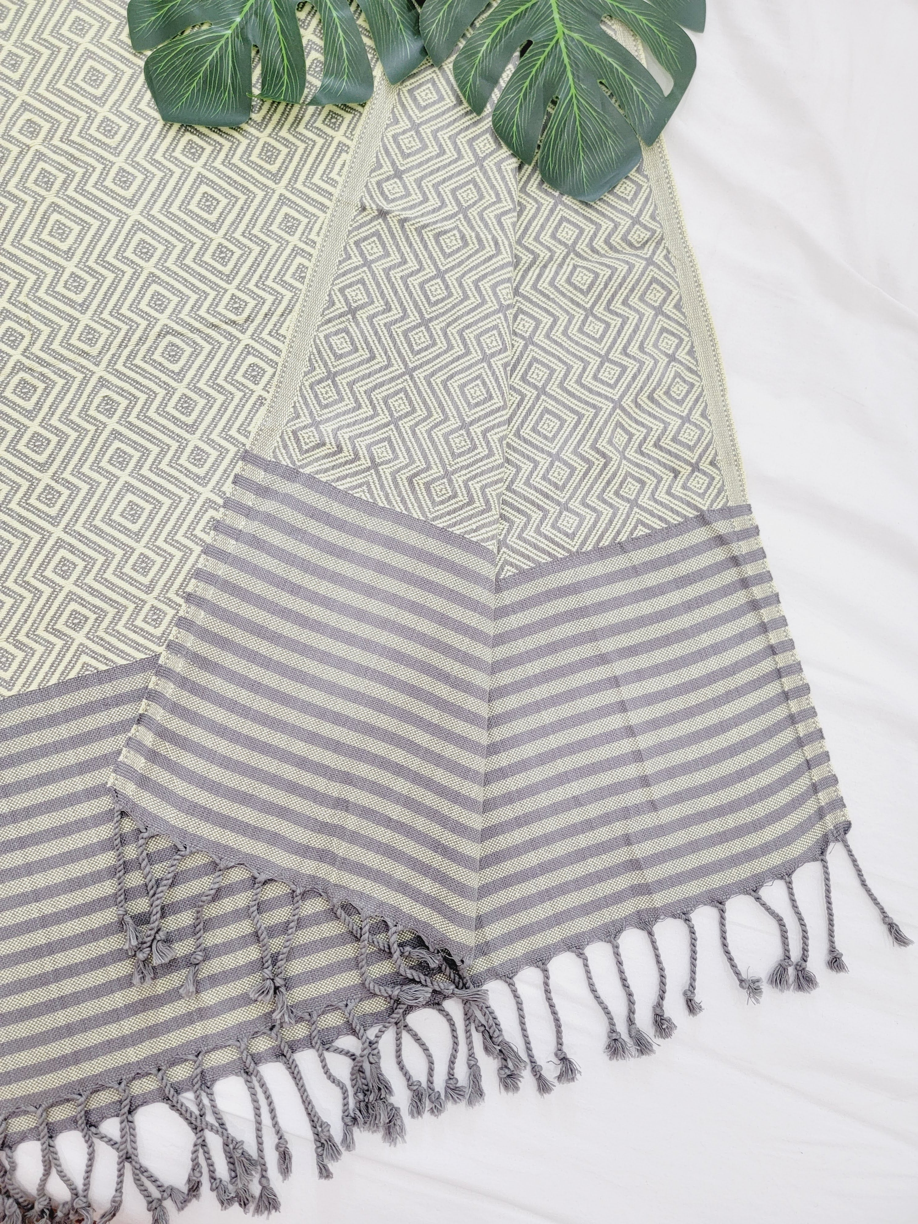 Textile with geometric pattern and striped design on a white background