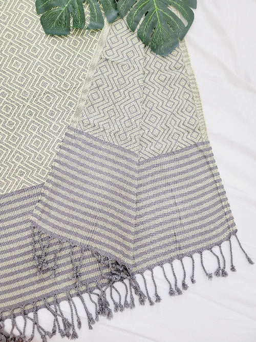 Textile with geometric pattern and striped design on a white background