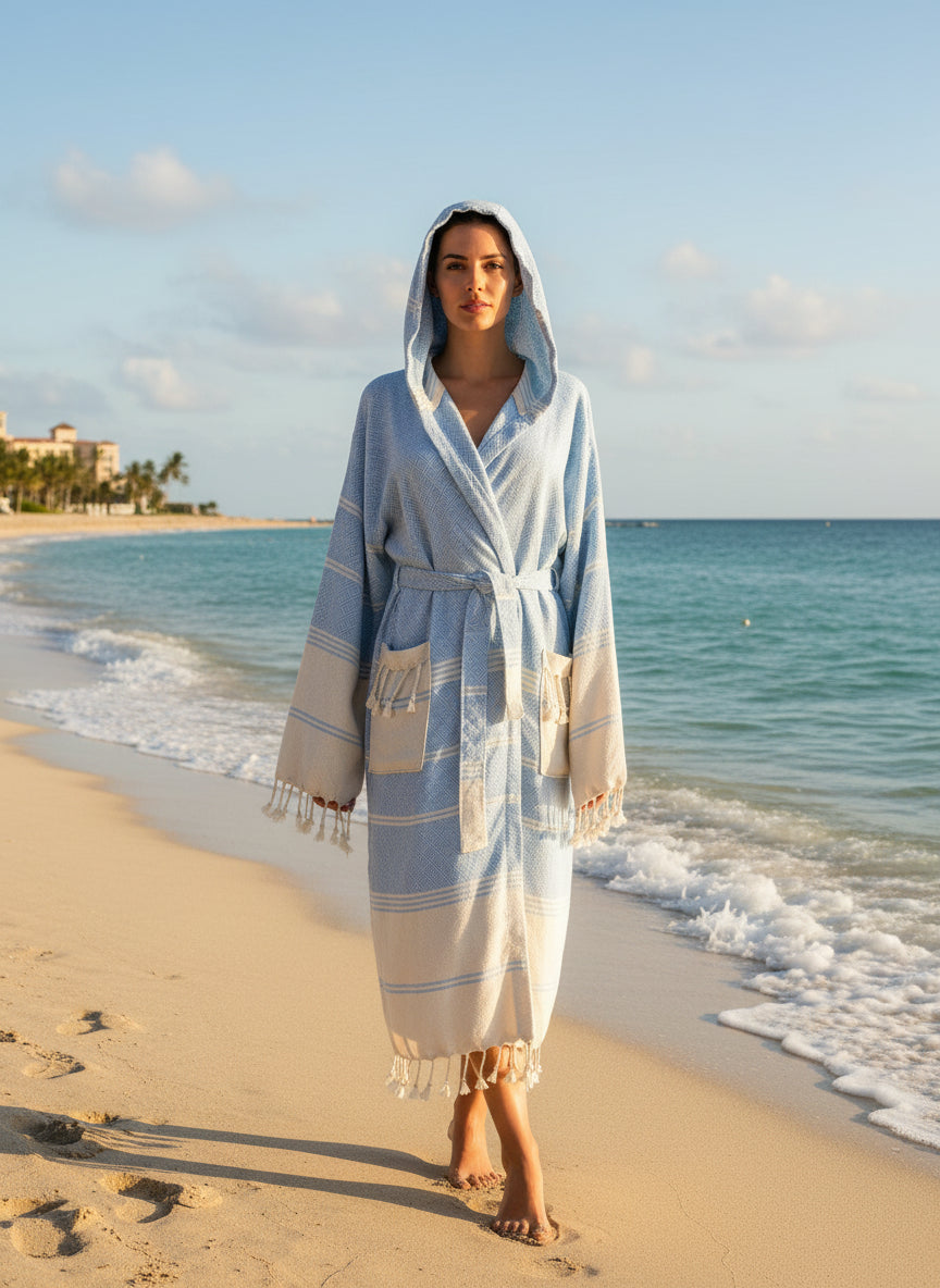 Light blue and beige robe with hood on a mannequin against a plain background