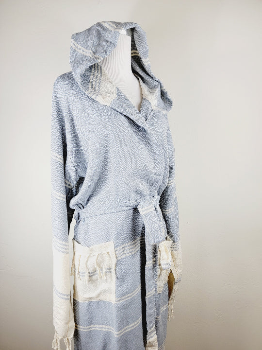 Light blue and white textured robe with hood on a mannequin against a neutral background