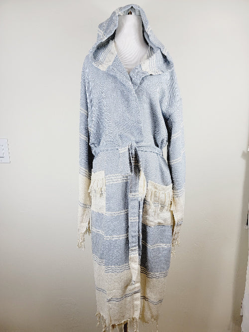 Light blue and white robe with hood on a mannequin against a plain background