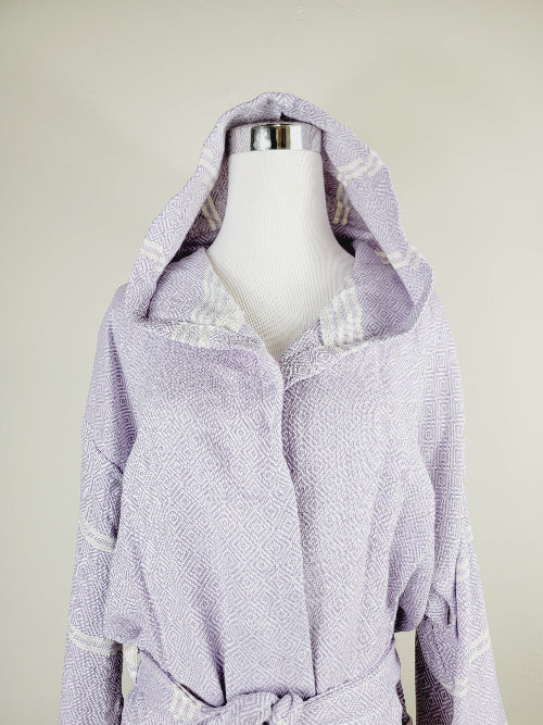 Lavender bathrobe with white stripes on a mannequin against a beige background