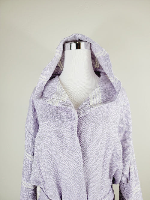 Mannequin wearing a light purple textured jacket on a plain background
