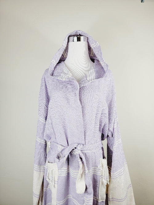 Lavender hooded garment on a mannequin against a plain background