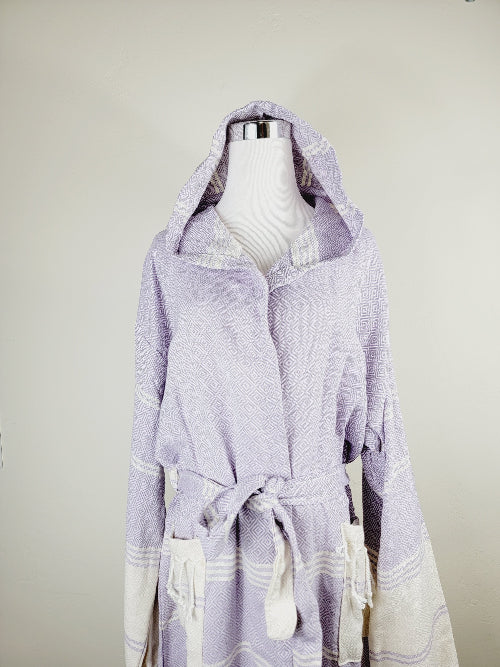 Lavender hooded garment on a mannequin against a plain background