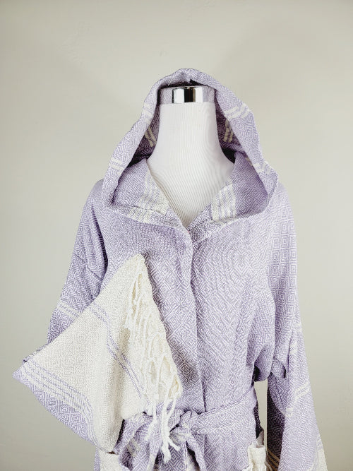 Lavender hooded robe with white accents on a mannequin against a neutral background