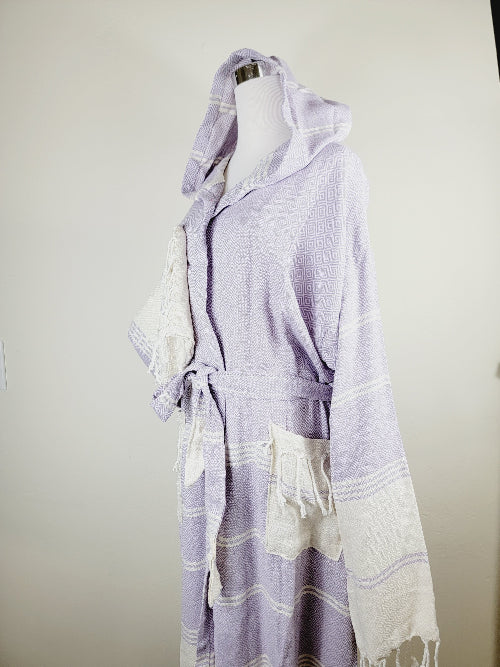 Lavender and white patterned robe on a mannequin against a plain background