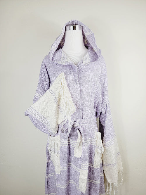 Lavender hooded towel with white stripes on a mannequin against a white background
