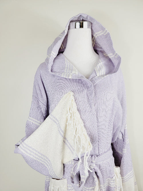 Mannequin wearing a light purple hooded garment with white accents on a plain background