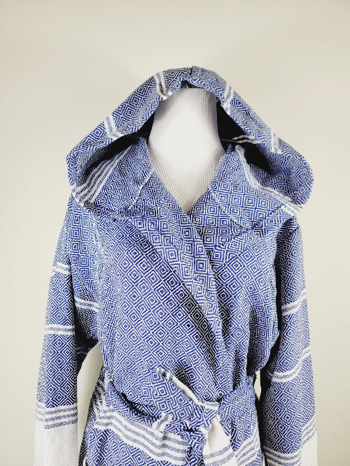 Blue patterned robe with white accents on a beige background