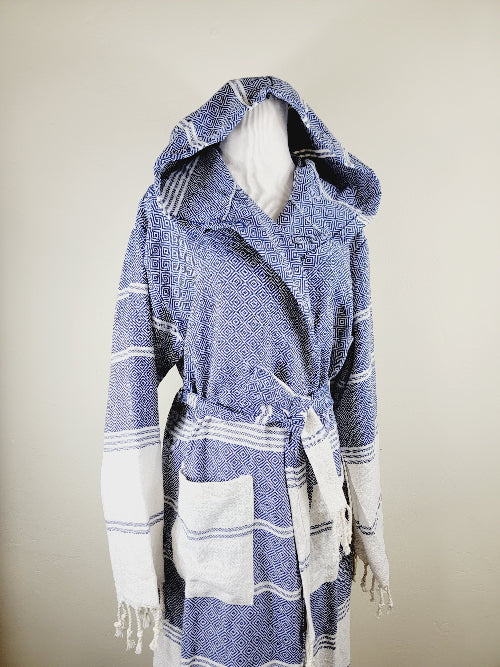 Blue and white striped robe on a mannequin against a beige background