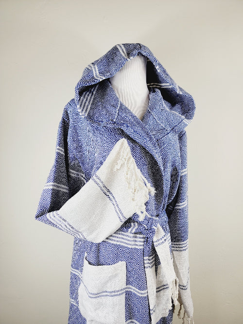 Blue and white patterned robe on a mannequin against a plain background