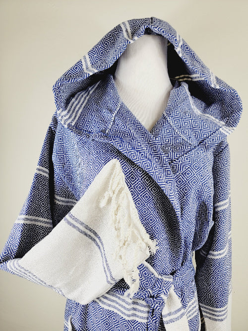 Blue and white patterned robe on a mannequin against a beige background