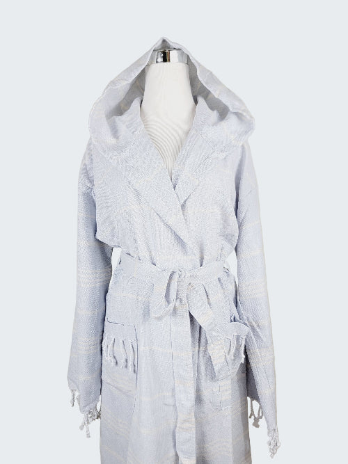 Light gray hooded robe on a mannequin against a beige background