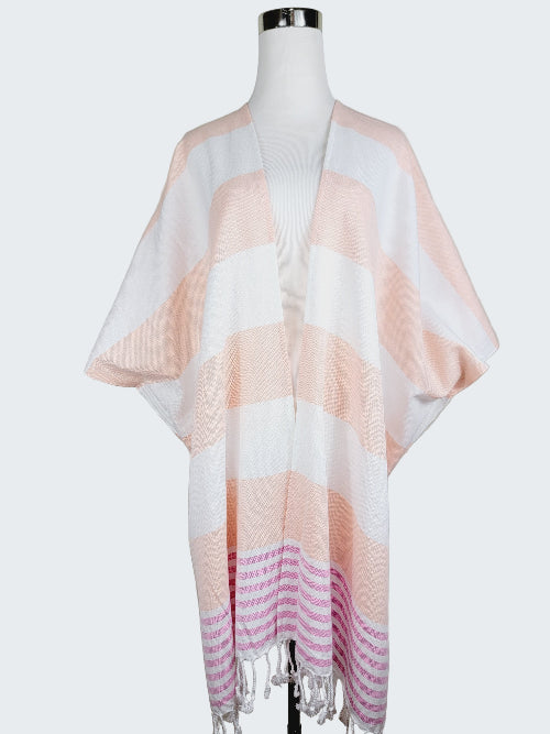 Striped scarf on a mannequin against a plain background