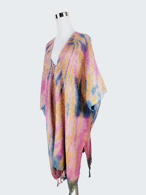 Colorful patterned scarf on a mannequin against a white background