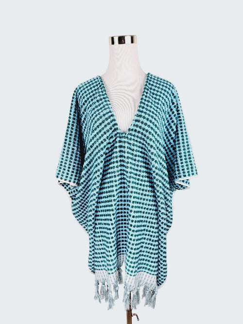 Teal and white checkered kimono-style garment on a mannequin against a beige background