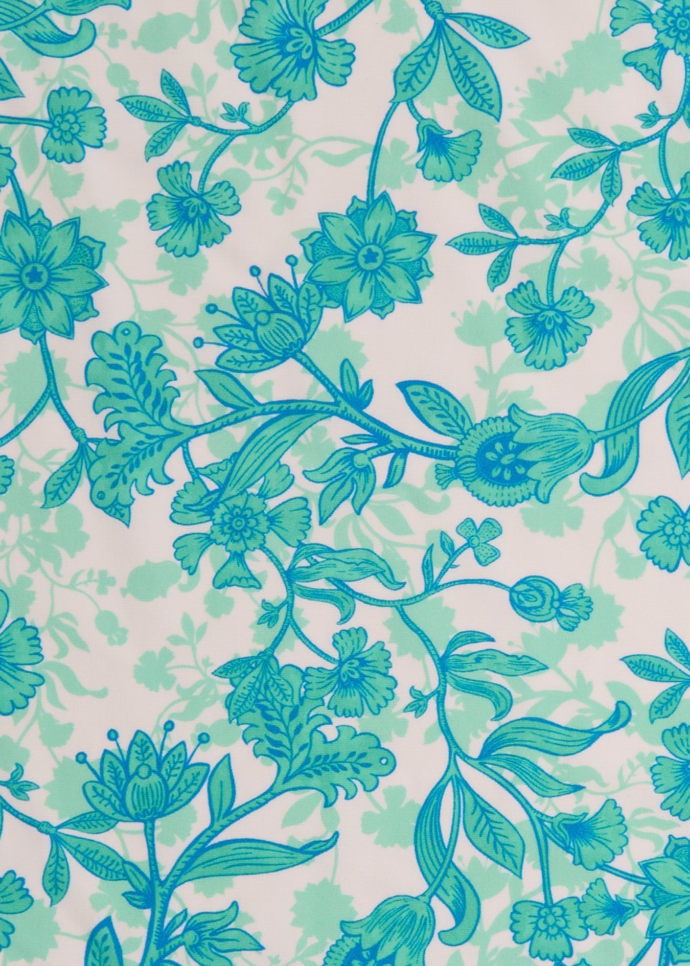Pattern of blue flowers and green leaves on a light background