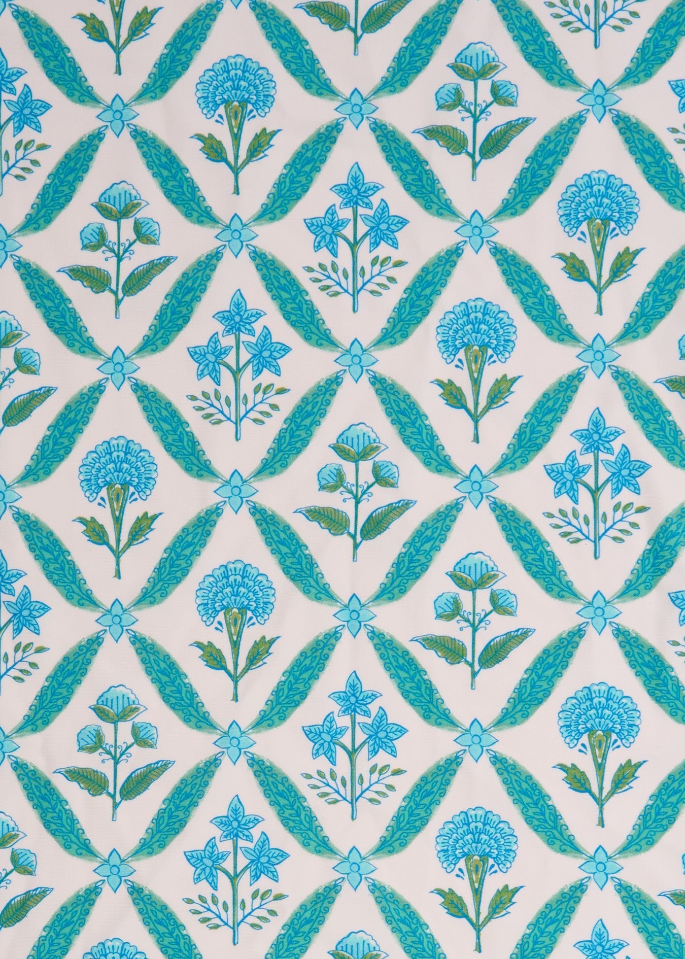 Patterned fabric with blue flowers and green leaves on a white background