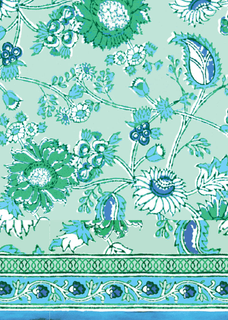 Decorative fabric with floral and paisley patterns on a light blue background