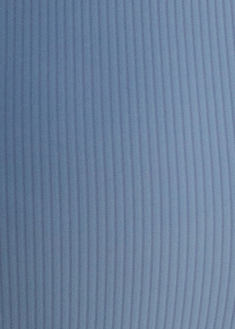 Close-up of blue fabric with a ribbed texture