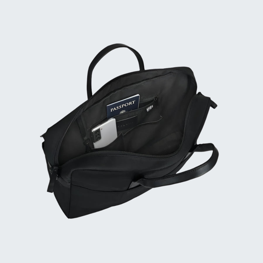 Black backpack with a compartment for a passport and phone on a white background