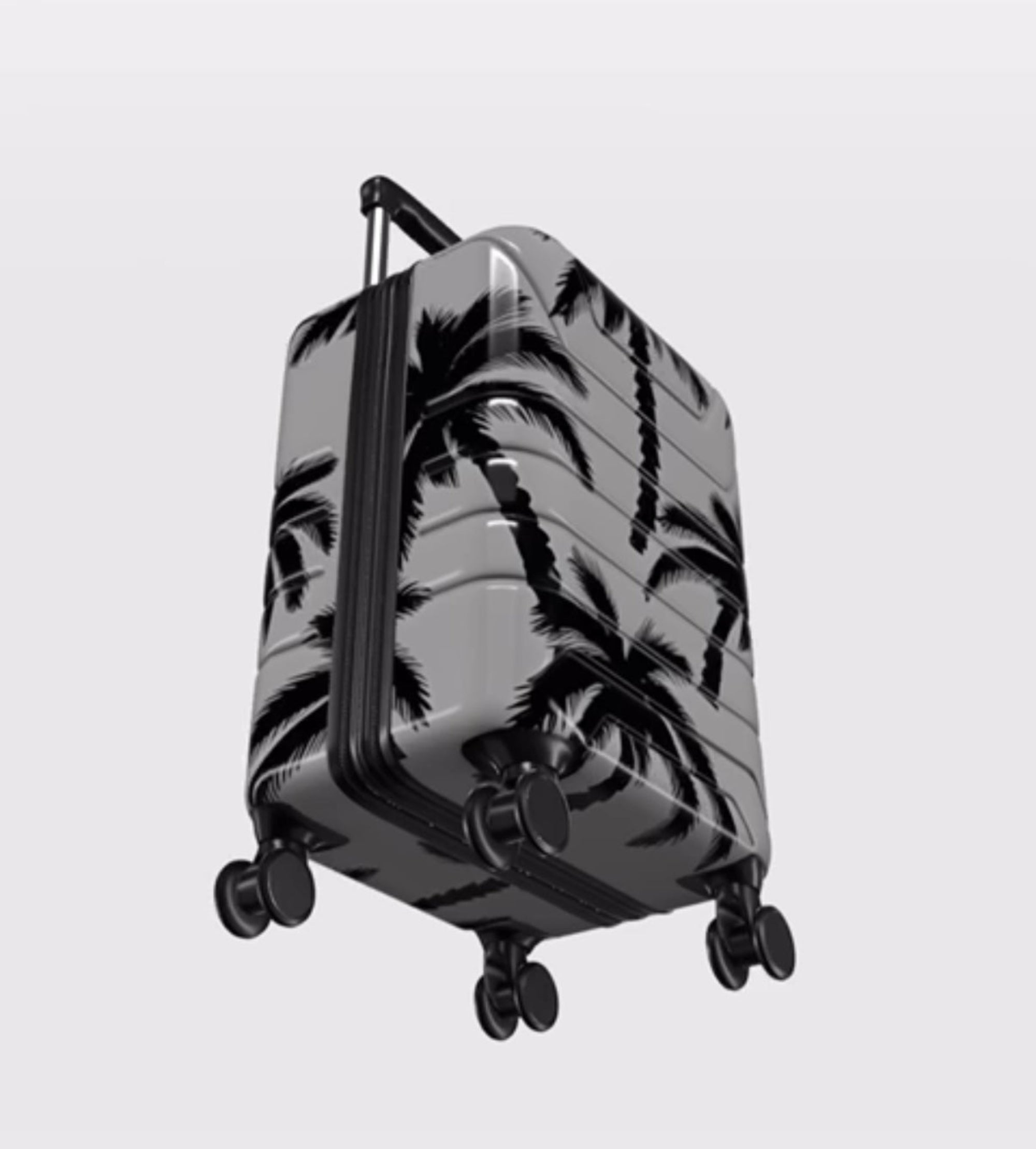 Suitcase with palm tree pattern on a light gray background