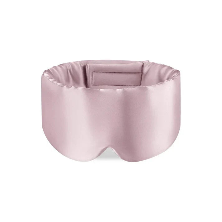 Pink satin eye mask on a white background