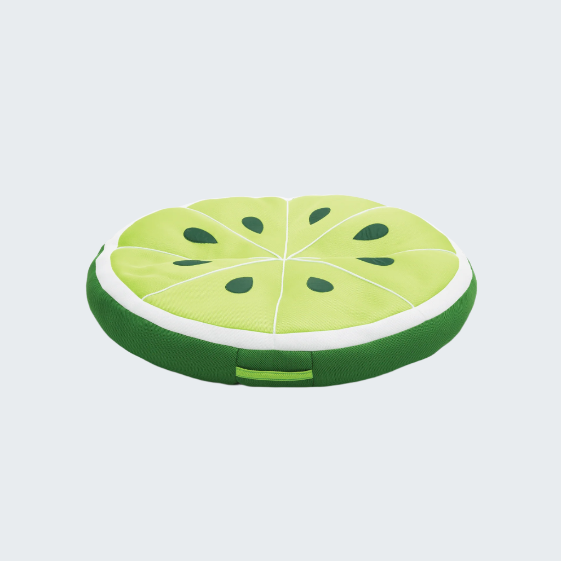 Round green cushion shaped like a watermelon slice on a black background