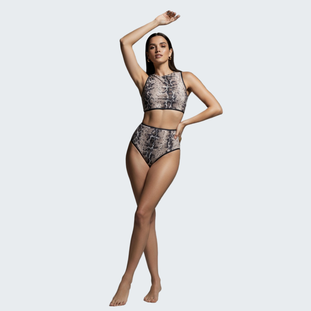 Woman wearing a patterned bikini set against a gray background