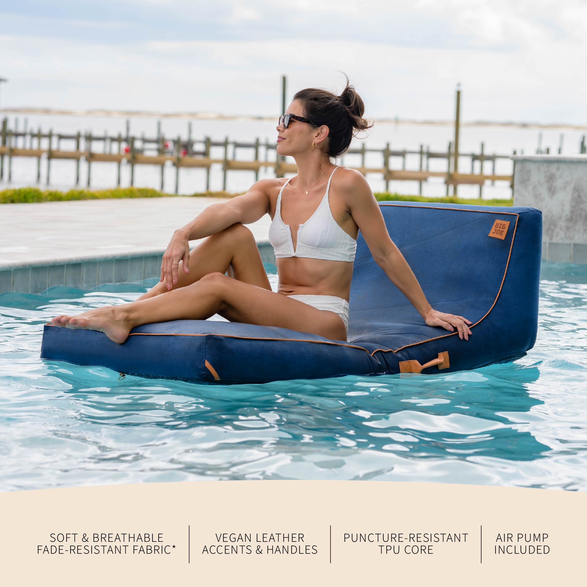 Woman sitting on a blue inflatable pool float in a pool with text about product features.