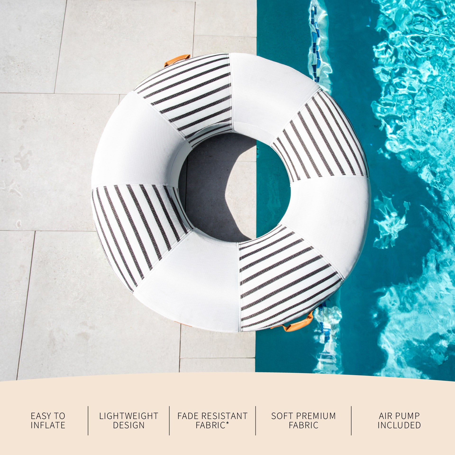 Inflatable pool float with geometric design by a pool