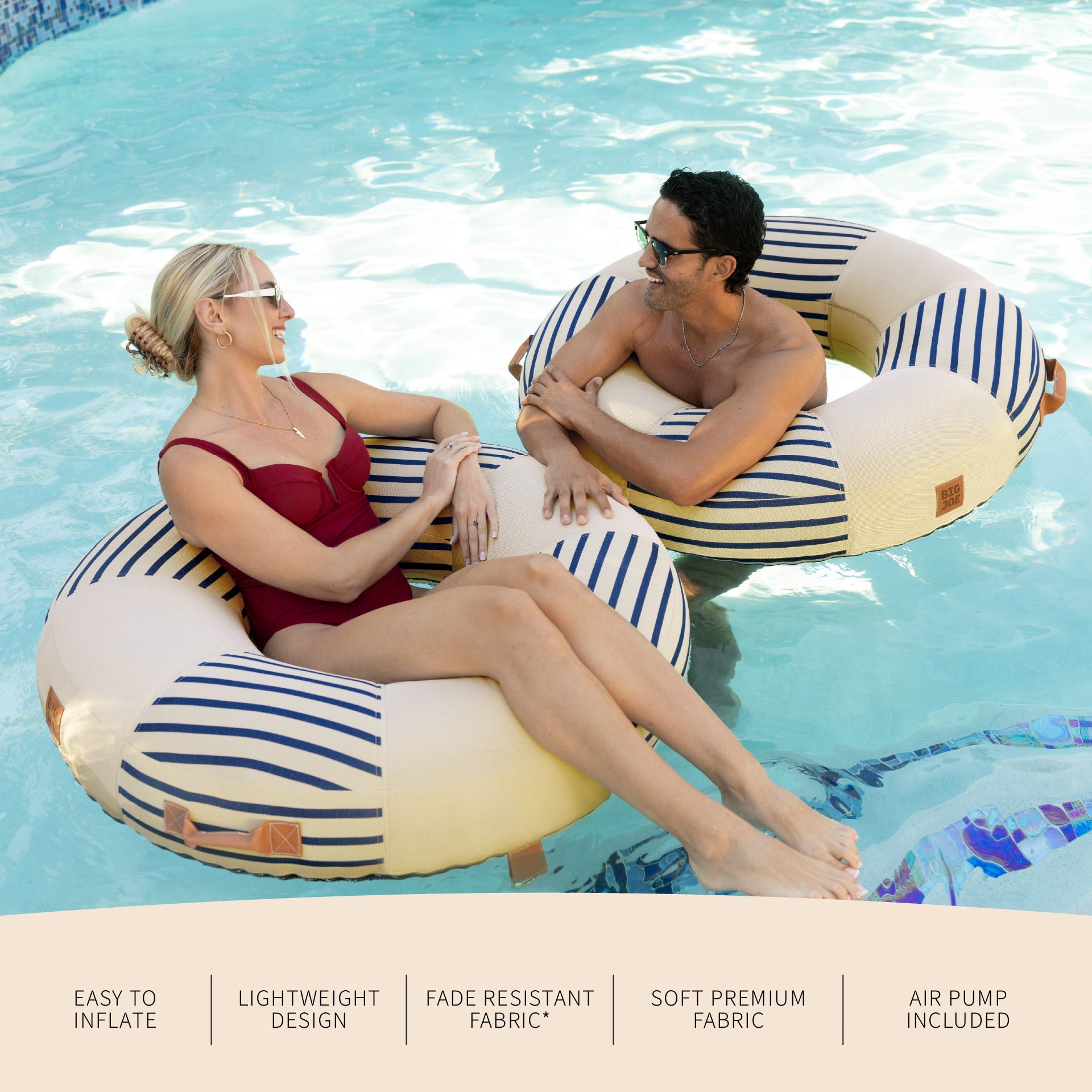 Two people relaxing on striped inflatable tubes in a pool with product features listed below.