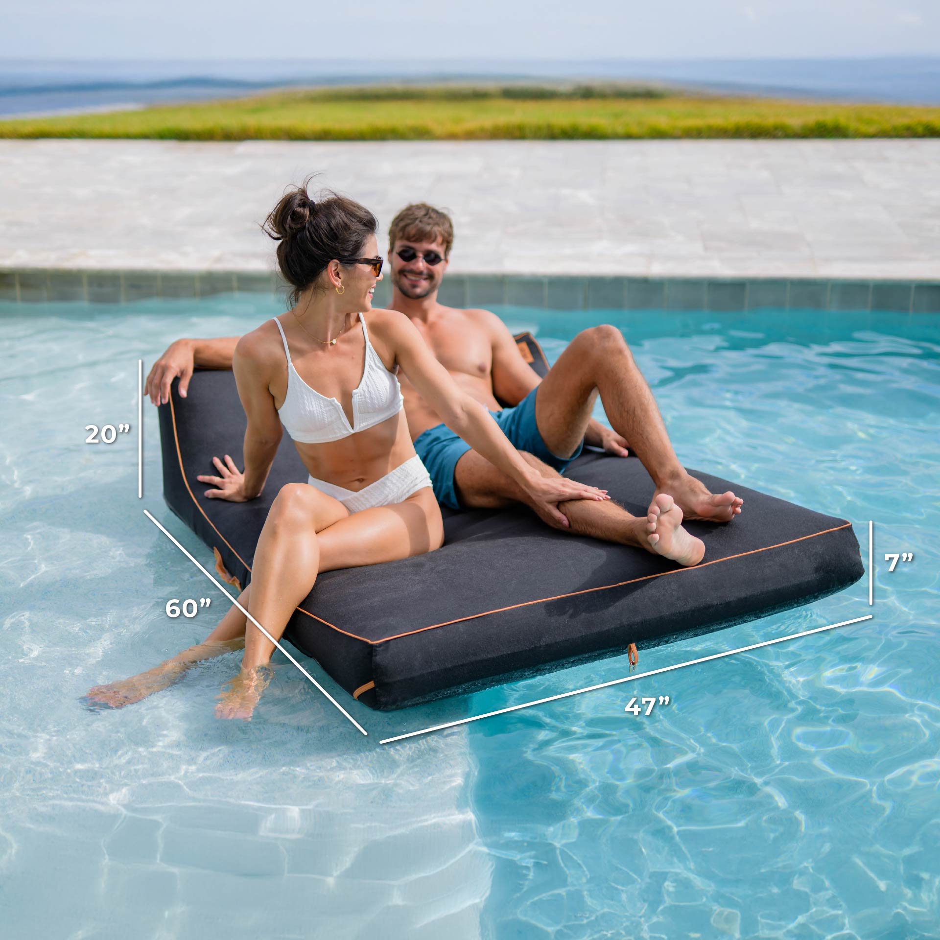 Two people sitting on a floating platform in a pool with dimensions displayed.
