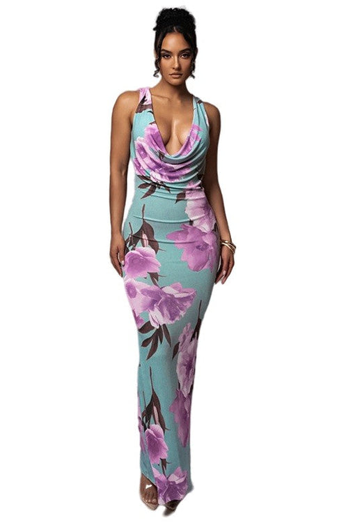A model wearing a floral long maxi dress with a cowl neck, sleeveless design, and back slit.