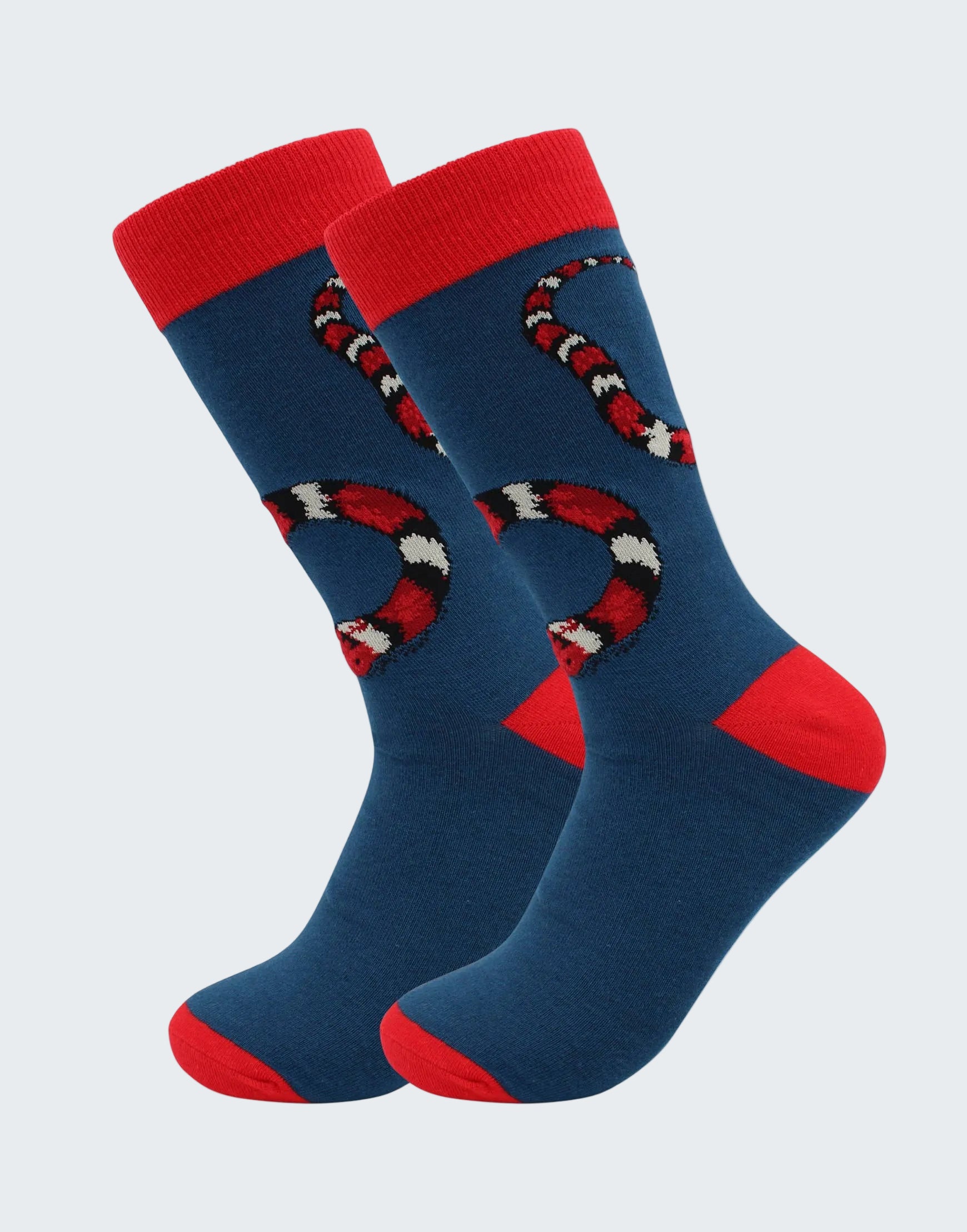 Pair of blue socks with red accents and snake design on a white background