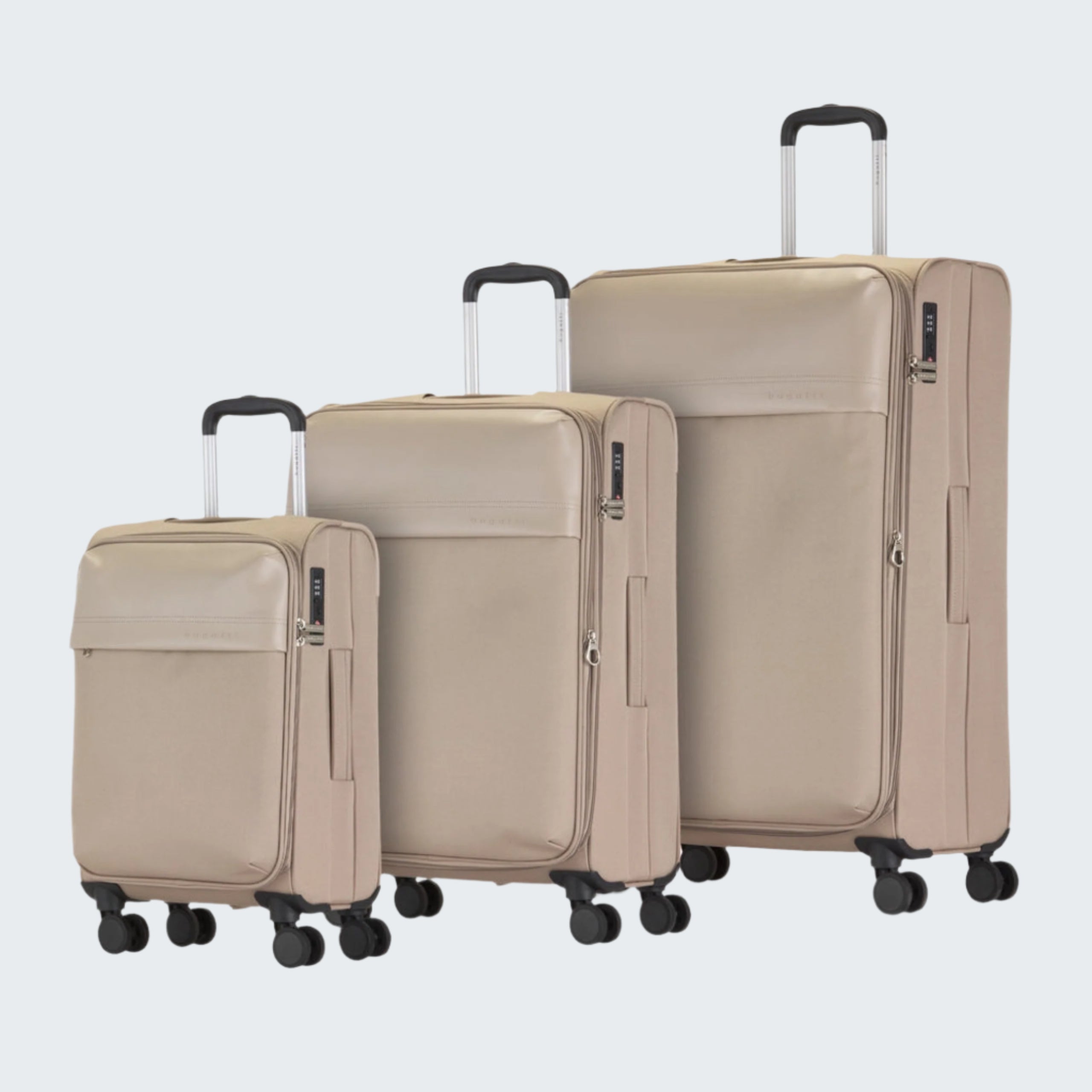 Set of three beige suitcases of different sizes on a white background