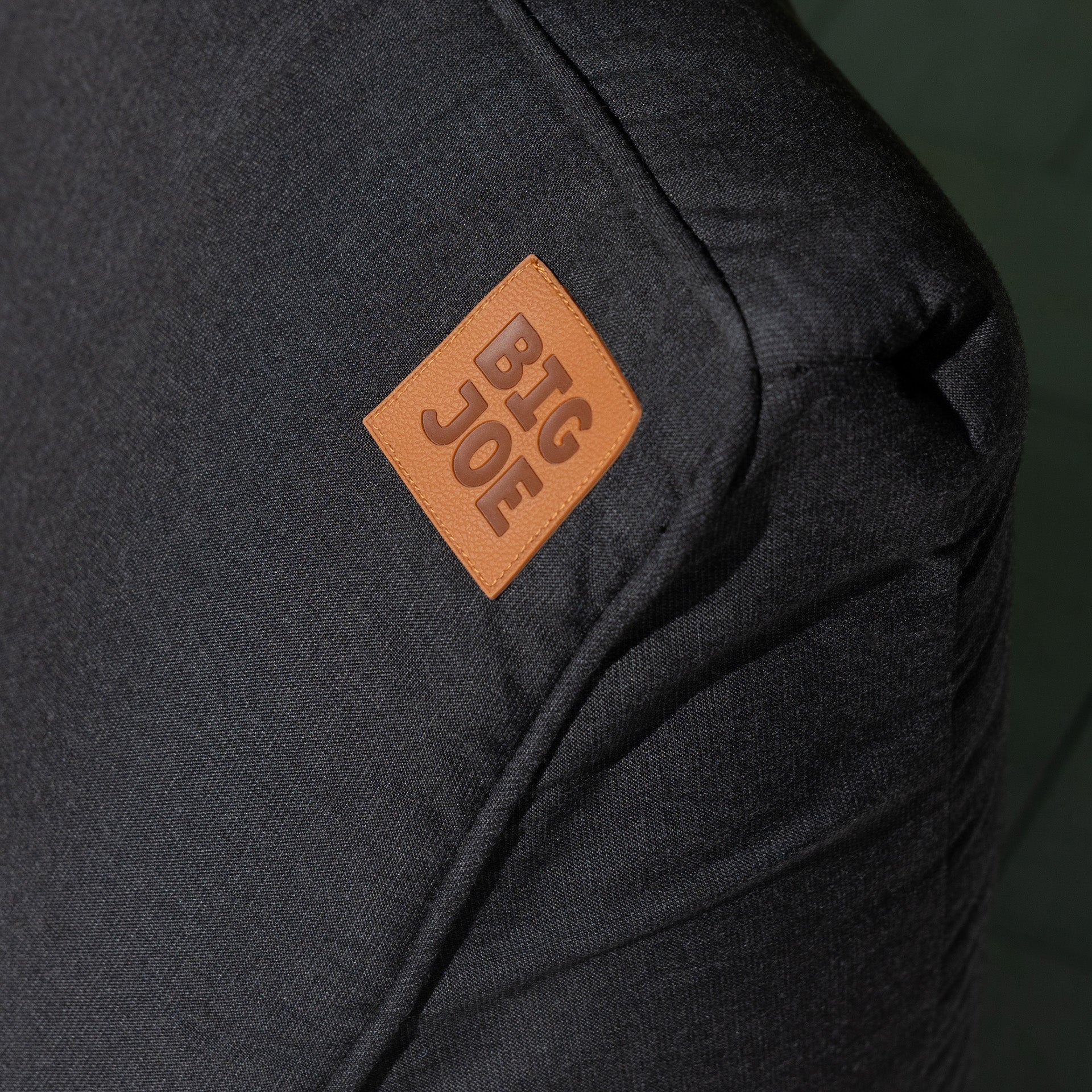 Black bag with a brown 'BIG JOE' logo on a dark green background