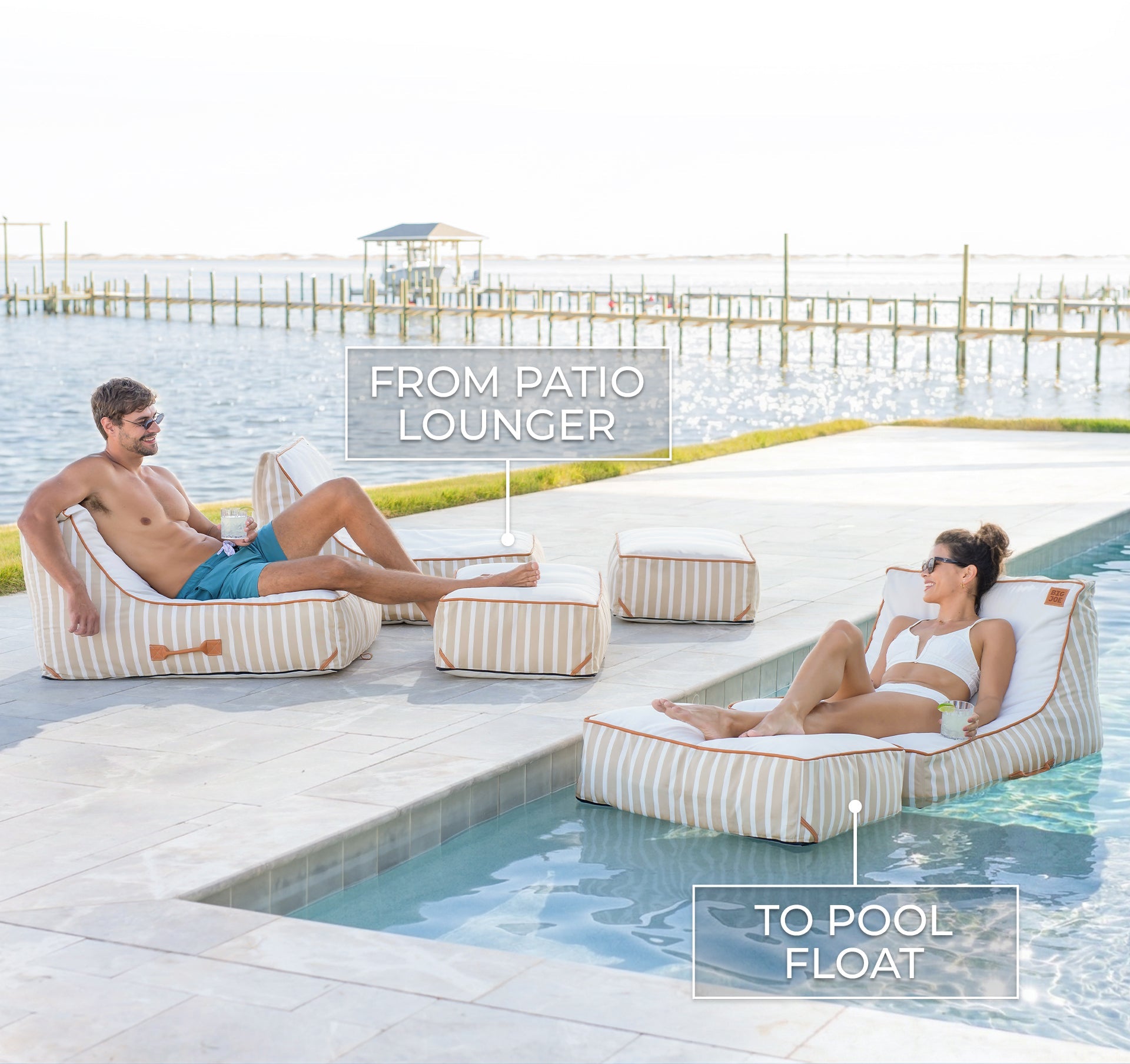 Two people lounging on striped patio chairs by a pool.