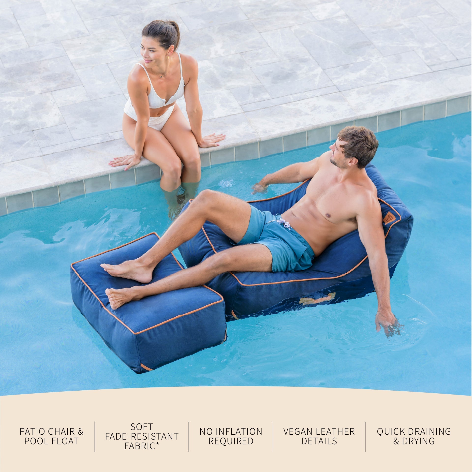 Two people relaxing on inflatable pool chairs by a pool.