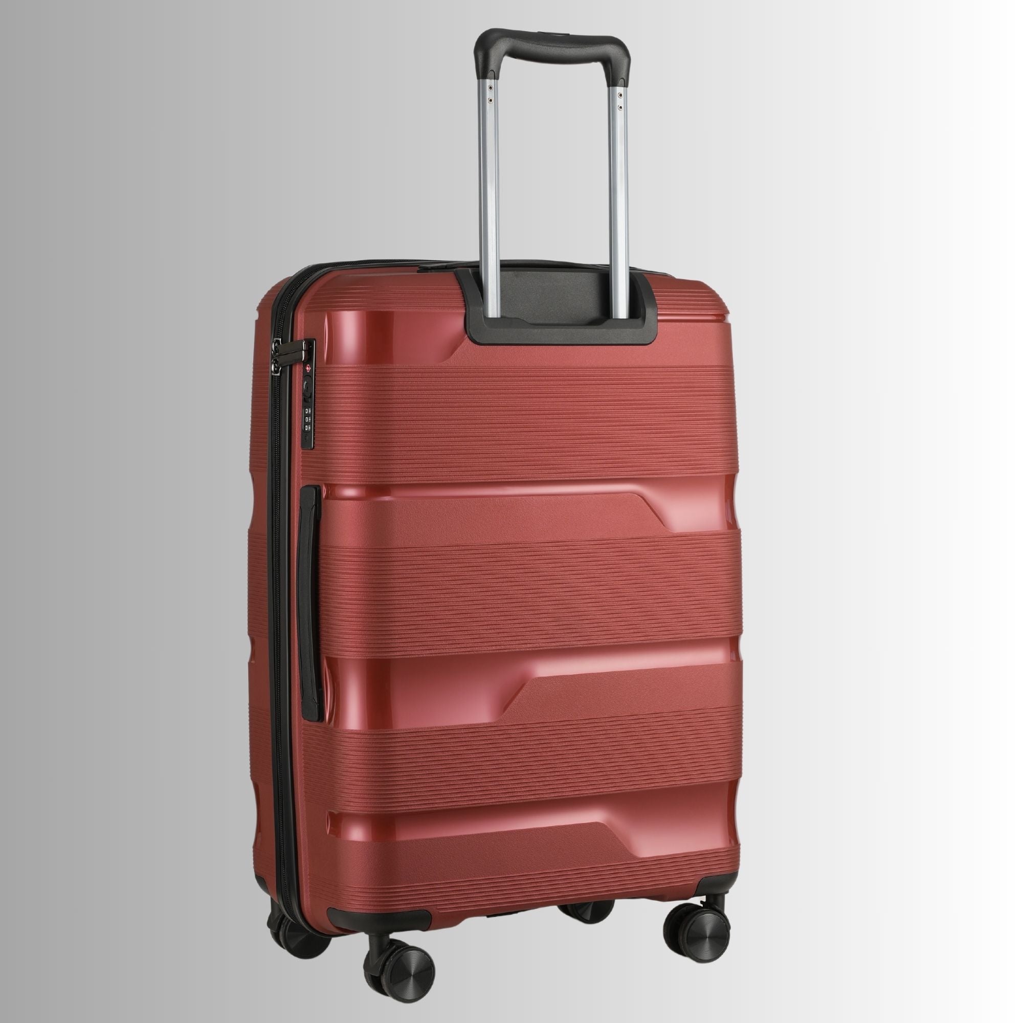 Red suitcase with a textured surface on a light gray background