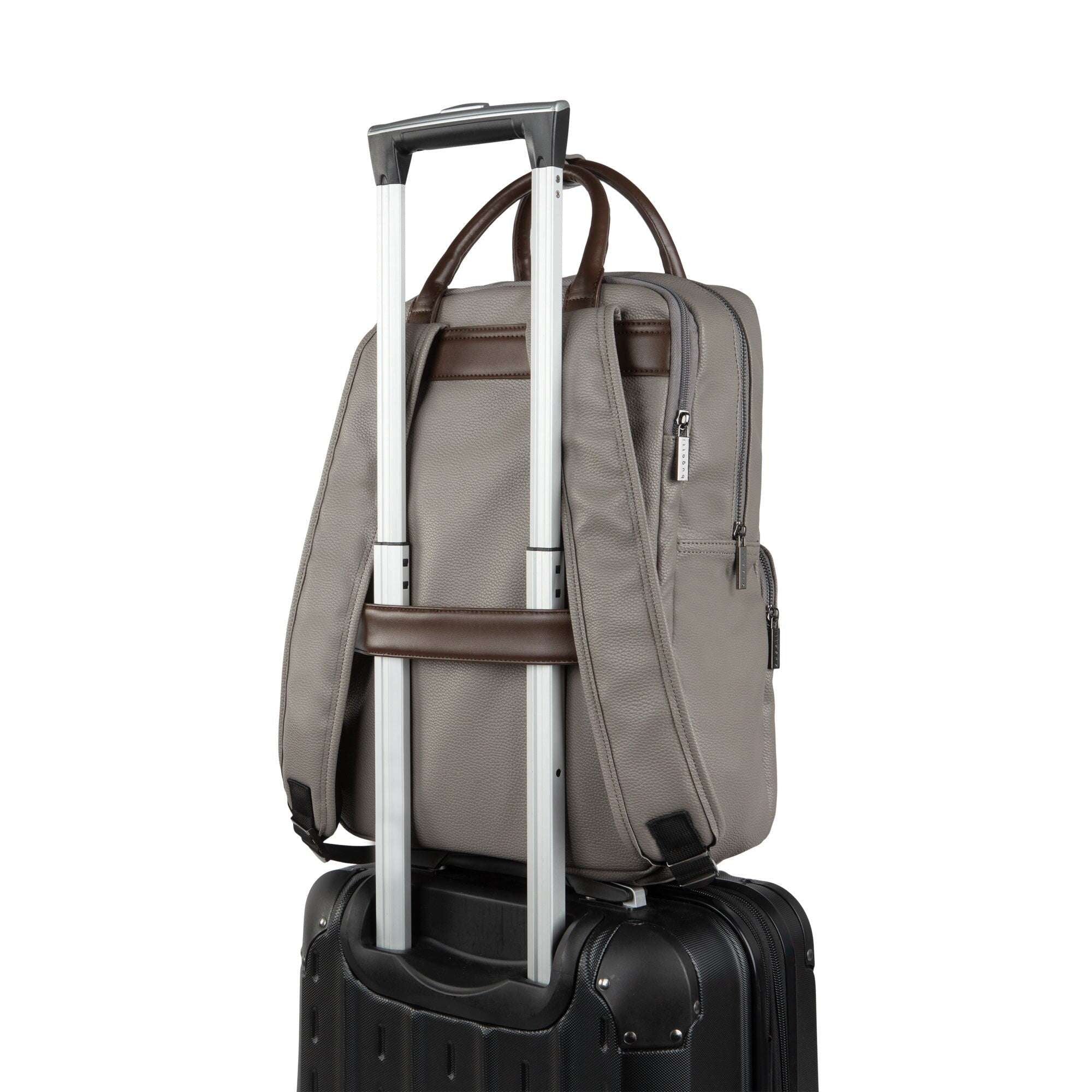 Gray backpack with rolling handle on a black suitcase against a white background